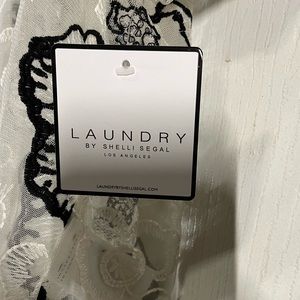 See through Laundry top. Cream color.